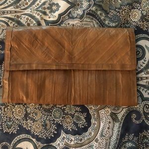 Eel skin ladies clutch. See pictures for details.